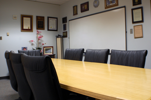 A photograph overlooking the conference table.