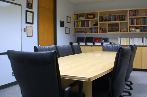 A photograph overlooking the conference table.